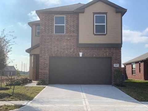 a house with a driveway and a garage door